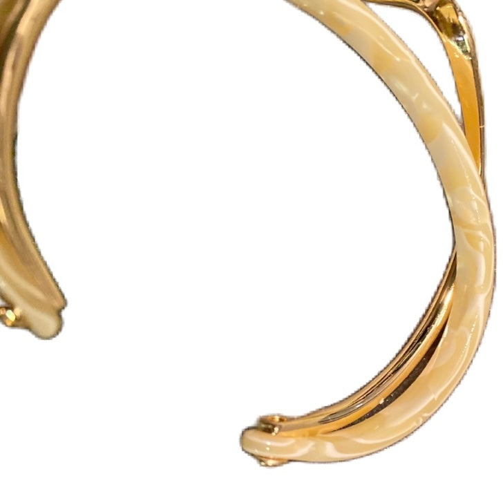 Boutique Twisted White Onyx And Gold Bangle