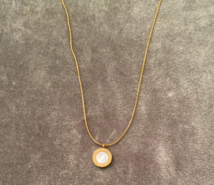 A Boutique Reversible Onyx Pendant Necklace